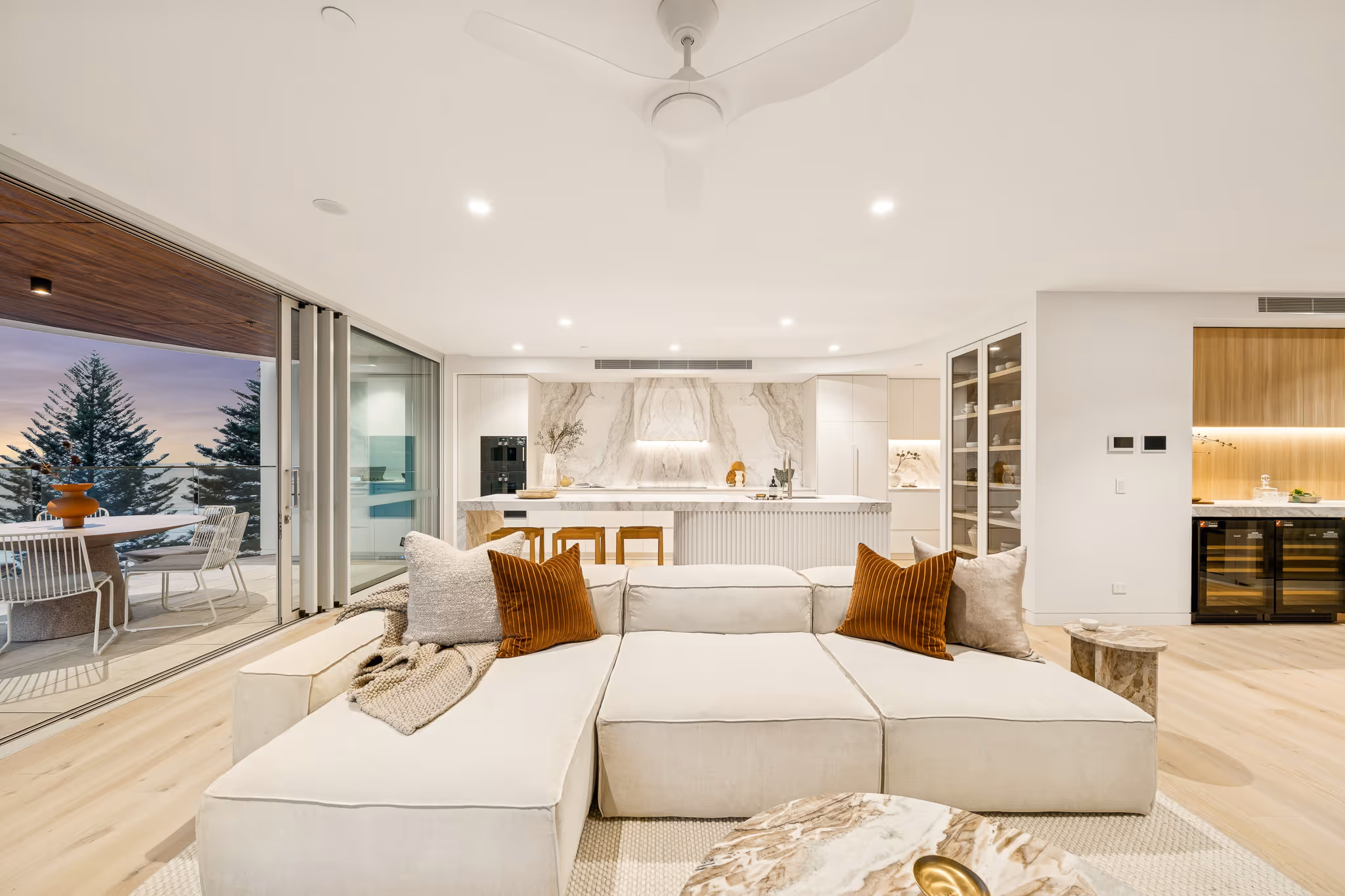 Rockpool living interior with kitchen and ocean view — a Pezet Matheson project